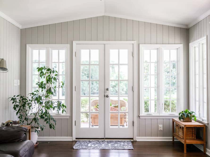 Windowed dorrrway inside of a beautiful home with white walls